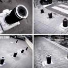 Canon с рекламой камеры на выезжающих парковочных колонках